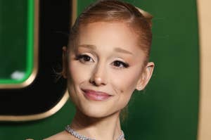 Ariana Grande in elegant off-the-shoulder gown with sleek hairstyle and choker necklace, attending a formal event