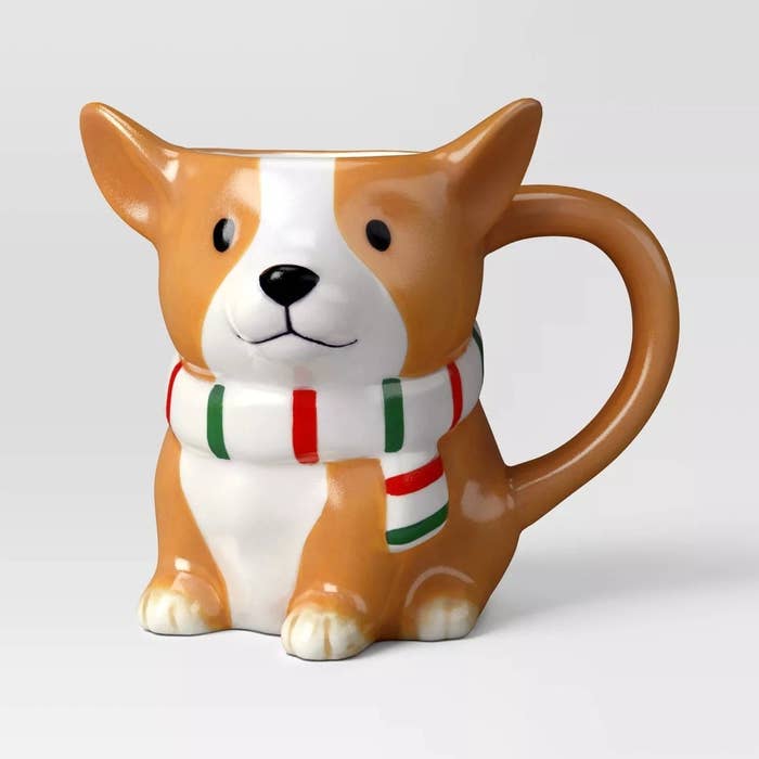 Ceramic mug shaped like a corgi dog wearing a striped scarf