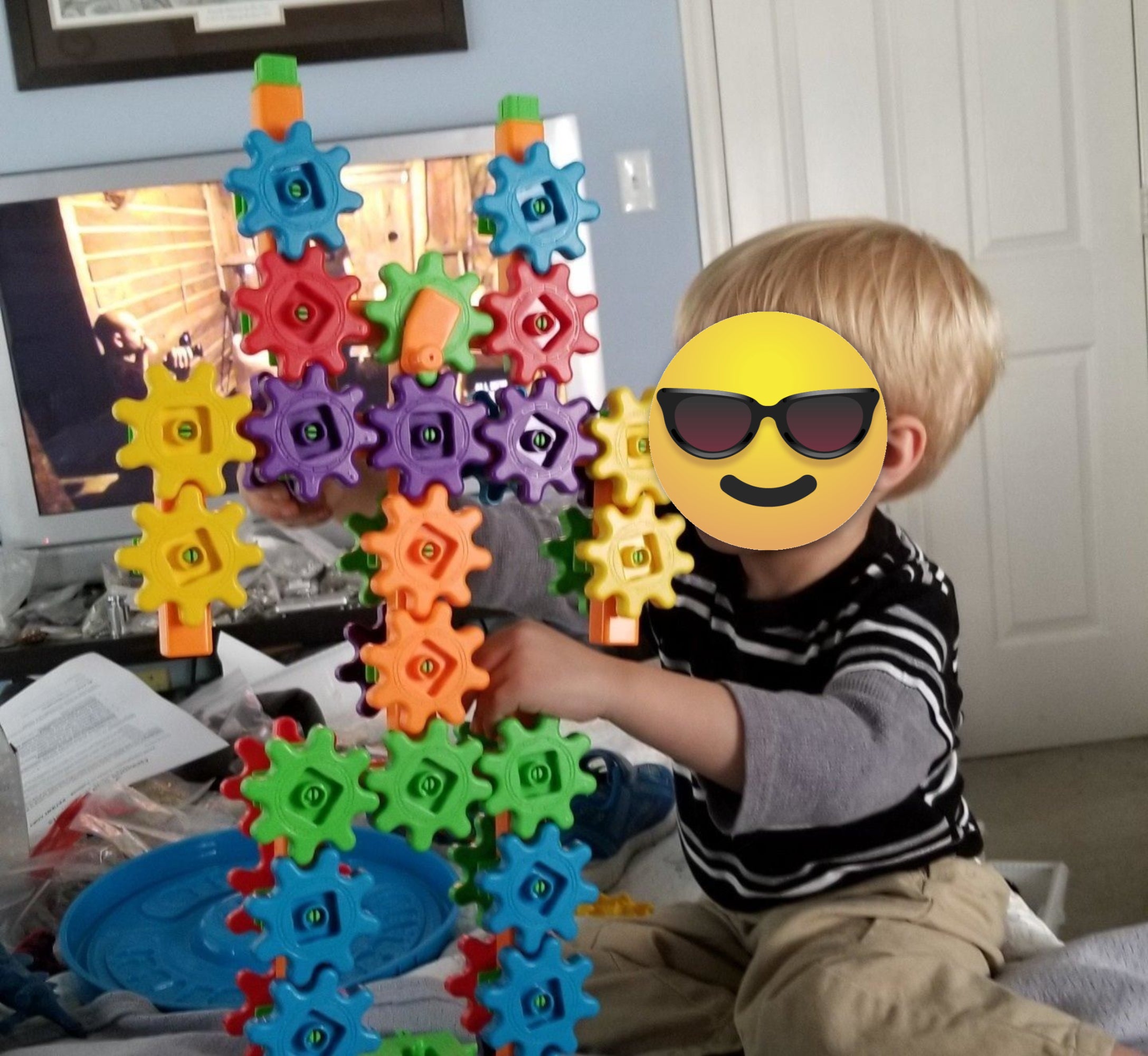 A kid  creating with the gears