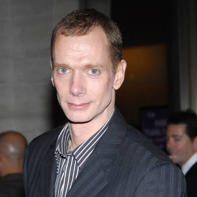 Doug in a pinstripe suit with a striped shirt at a formal event