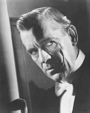 Black-and-white image of Boris in a tuxedo looking intensely at the camera