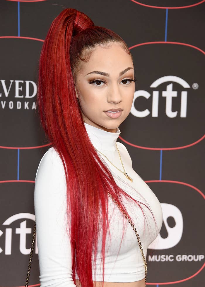 Bhad Bhabie on the red carpet wearing a stylish high ponytail and form-fitting turtleneck top