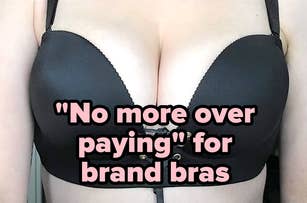 A family of five, wearing plush, hooded blankets, sits closely together on a couch, smiling and looking comfortable