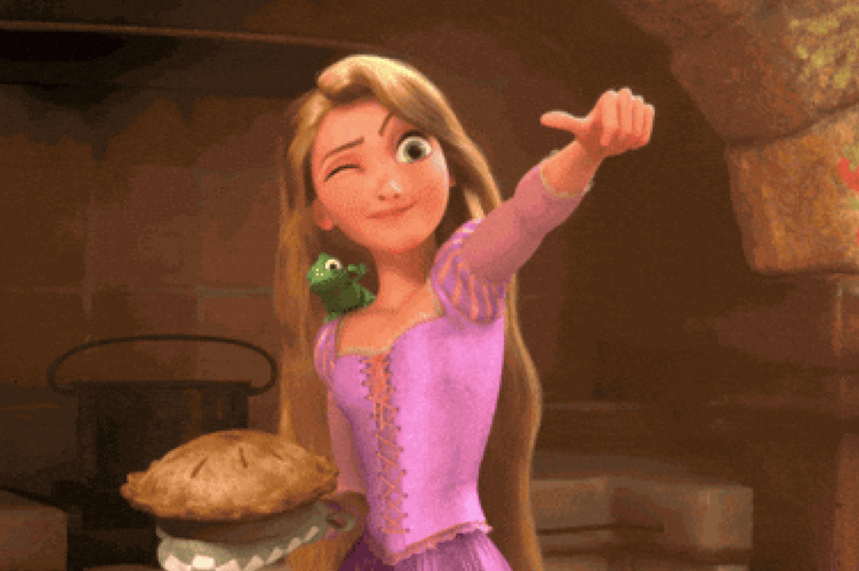 Animated character with long hair wearing a dress holds a pie and gives a thumbs-up, with a small green creature on her shoulder
