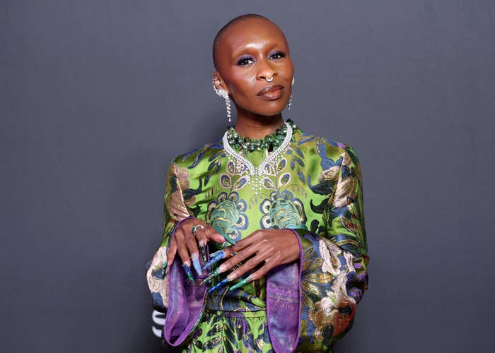 Cynthia Erivo in ornate floral-patterned dress with statement jewelry poses confidently