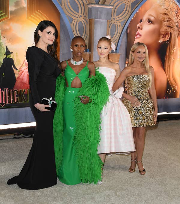 Idina Menzel, Cynthia Erivo, Ariana Grande, Kristin Chenoweth pose elegantly on a red carpet