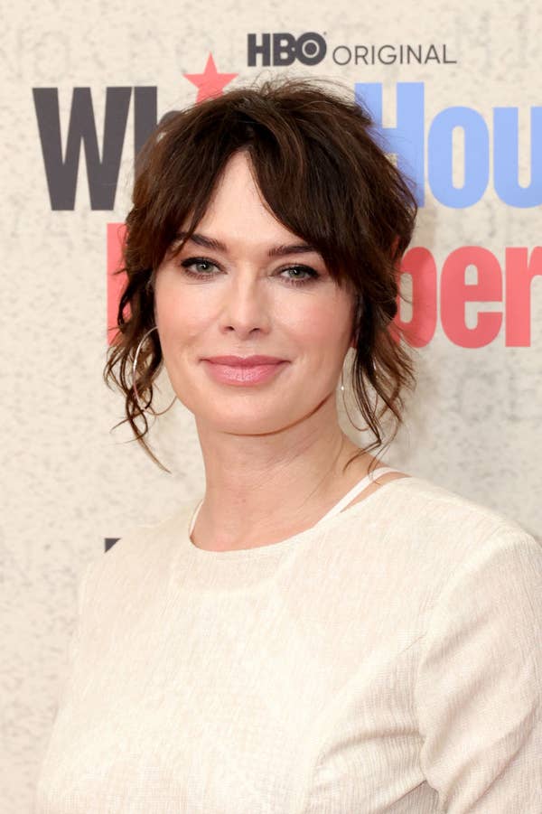 Lena in formal attire at an HBO event, standing in front of a backdrop with event logos