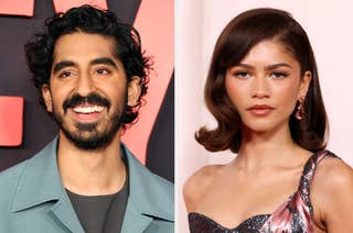 Two celebrities on the red carpet. Dev Patel is wearing a blue suit, and Zendaya is in a glossy, chic gown with elegant earrings