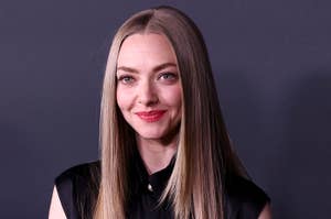 Person in sleek black dress poses on the red carpet at a celebrity event