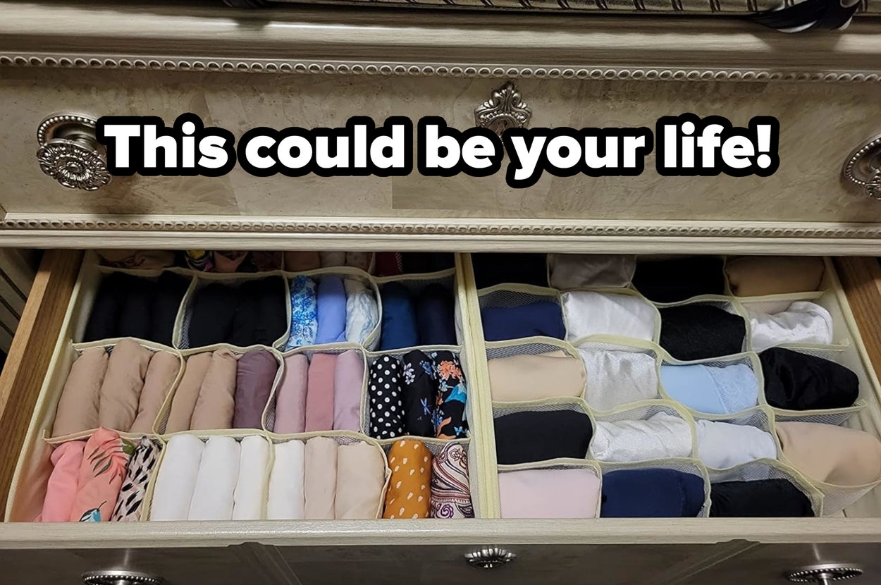 An open drawer organized with various folded socks in different styles and patterns for easy selection