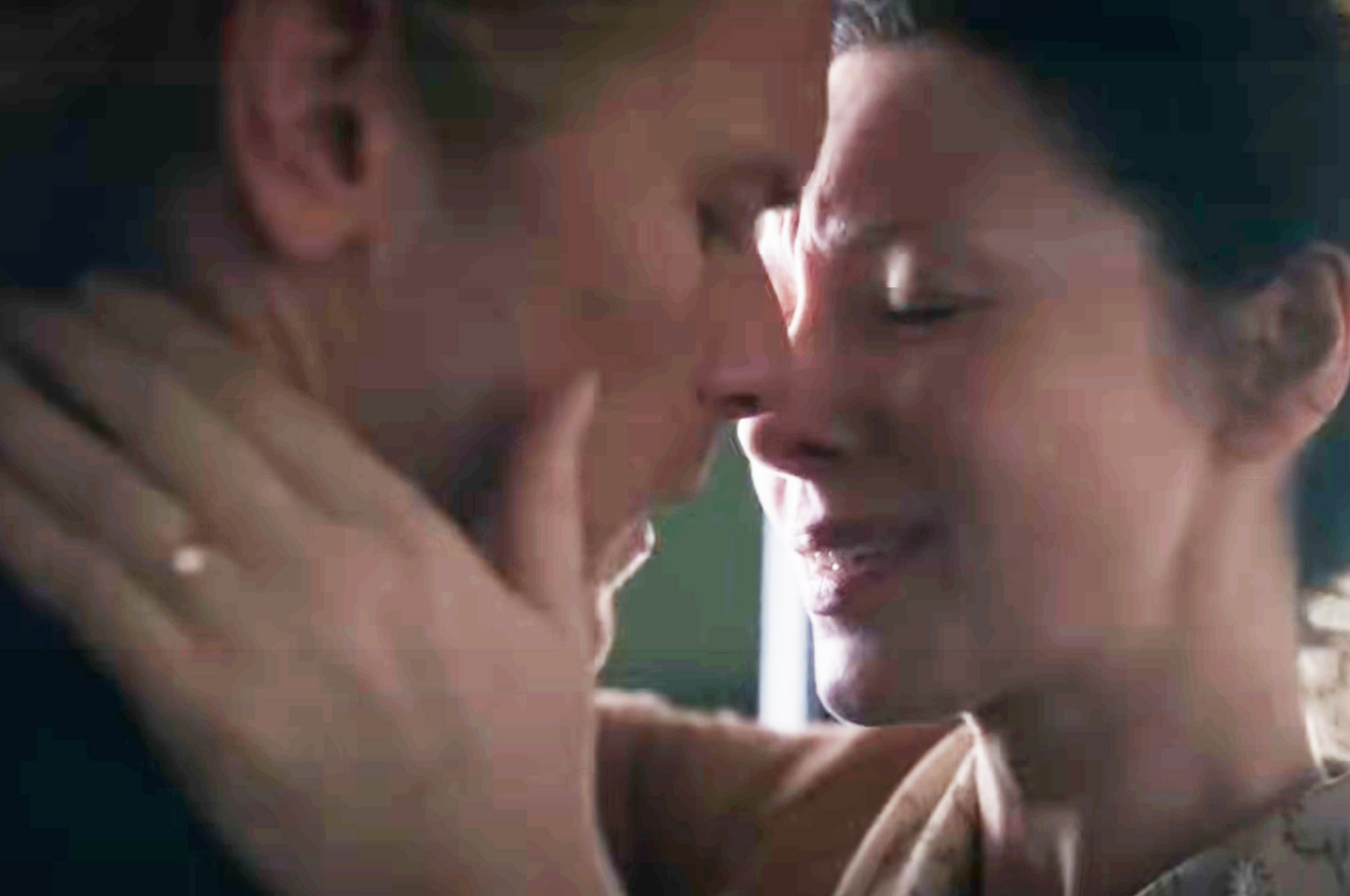 Claire and Jamie from "Outlander" shares an emotional moment, embracing closely with their eyes closed