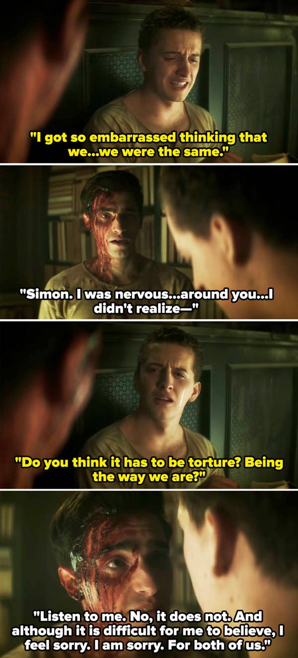 Two people having a tense conversation in a dimly lit room; one has blood on his face