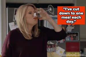 A woman drinks from a wine glass in a kitchen with a fridge in the background. A text bubble reads, "I've cut down to one meal each day."