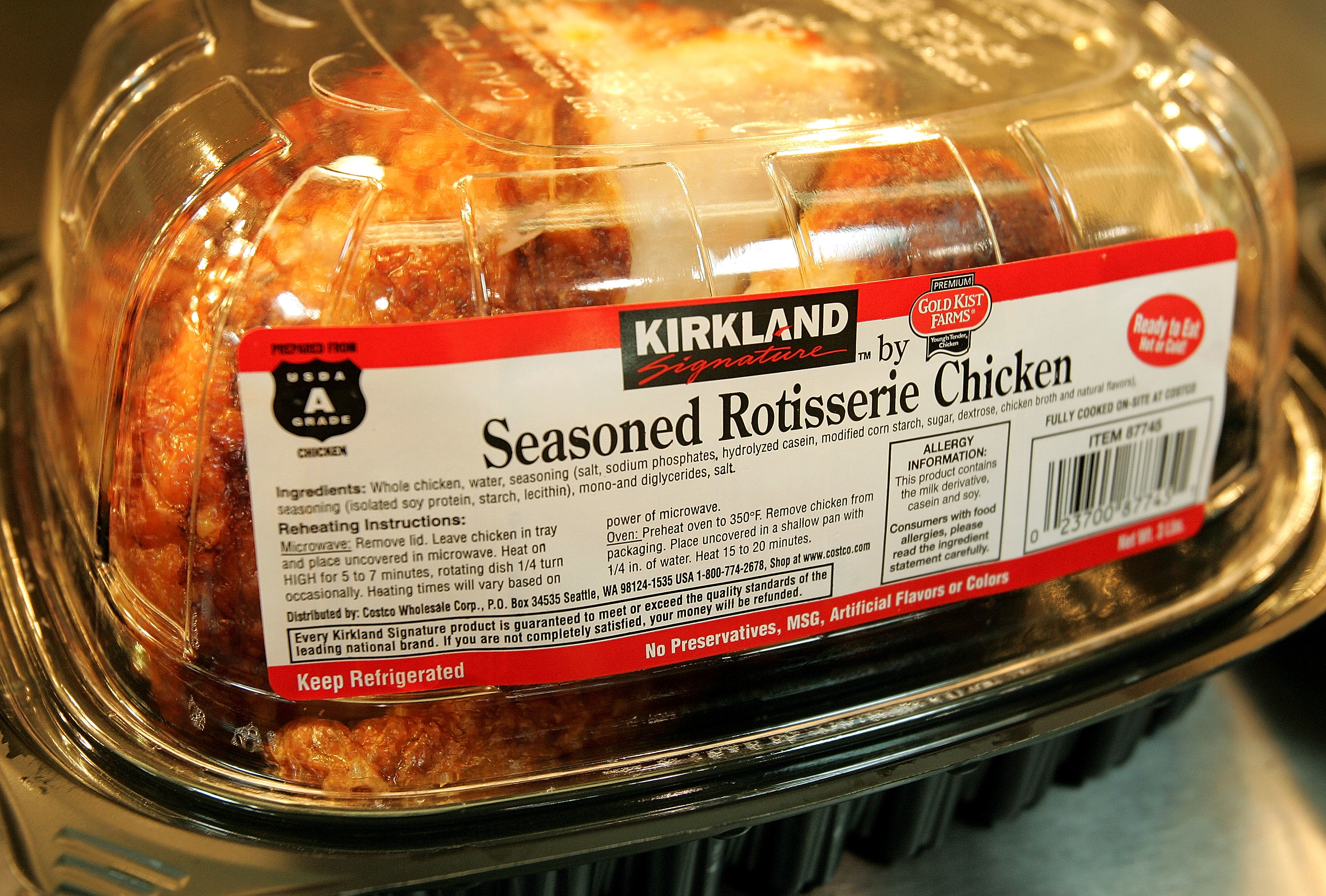 Package of Kirkland Signature seasoned rotisserie chicken with visible label listing ingredients and nutritional information