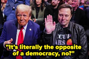 Two people are seated together; one waves, wearing casual attire, the other in a suit. Text reads: "It's literally the opposite of a democracy, no?"