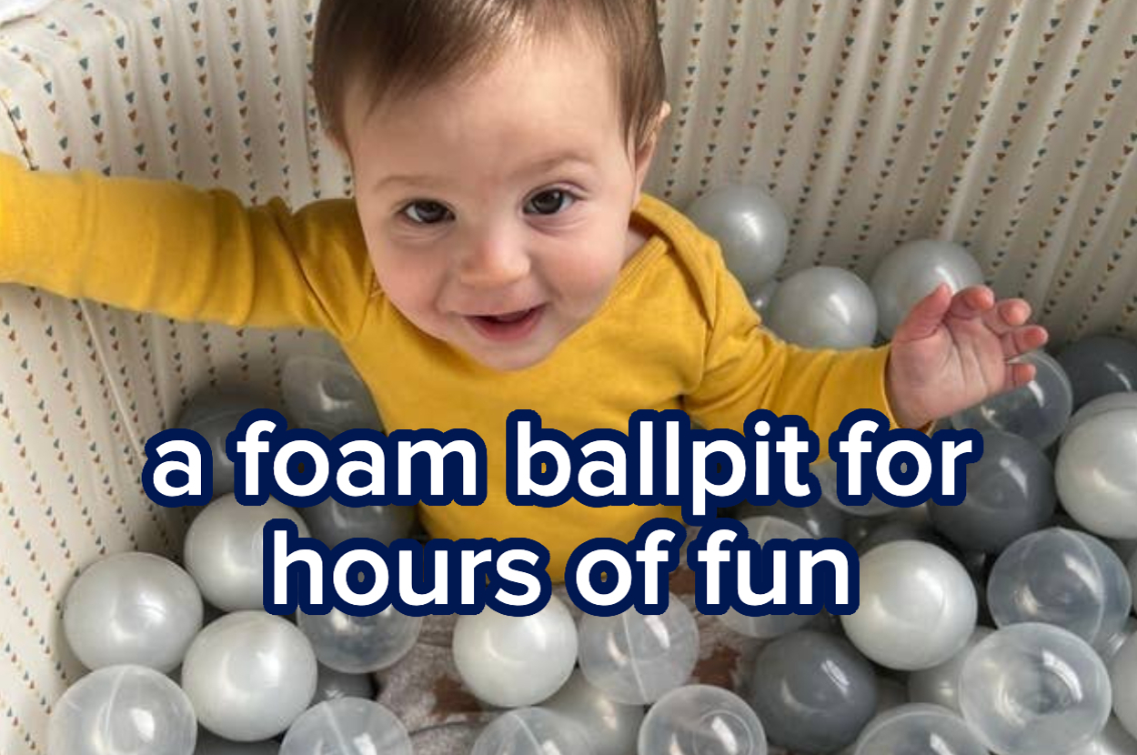 Child playing in a foam ball pit with text: "A foam ballpit for hours of fun."