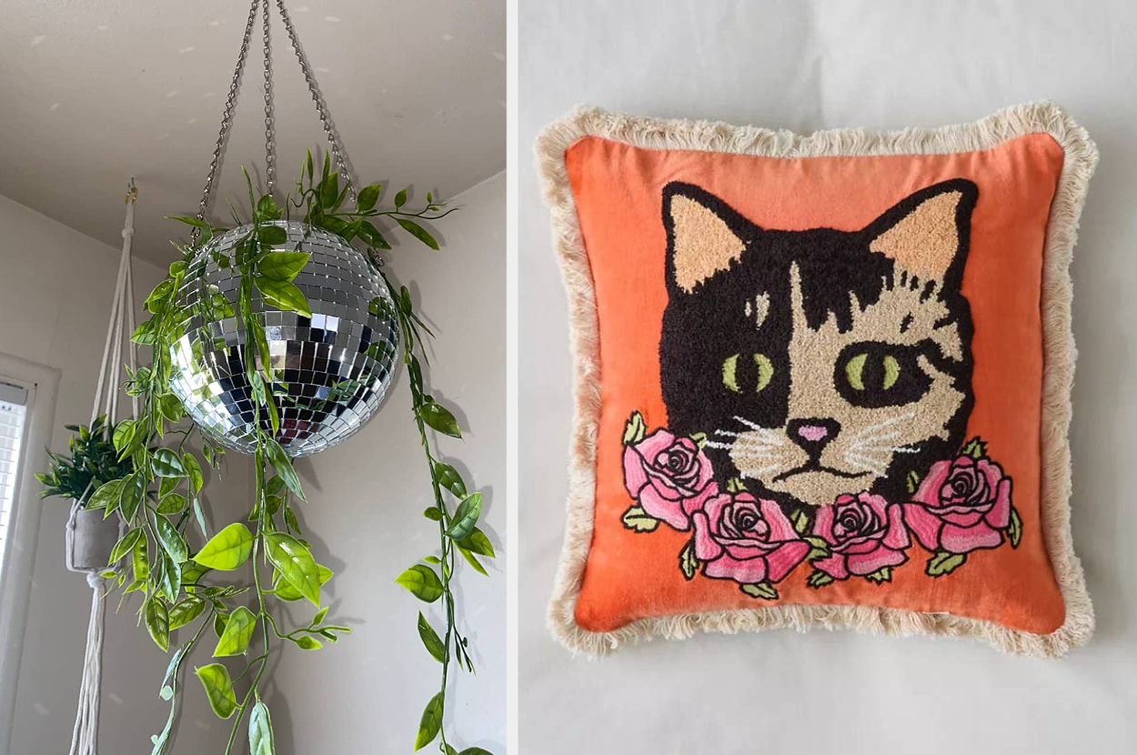 A hanging disco ball planter with green vines and a cushion featuring a cat surrounded by roses on an orange background