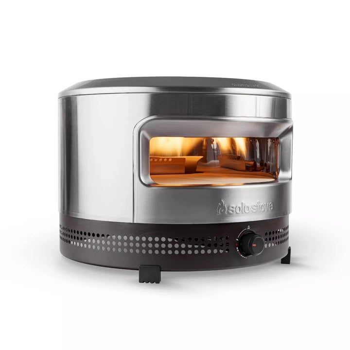 Portable stainless steel pizza oven showcased for home use