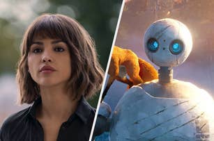 A woman with short hair in a casual black top is beside an animated robot with blue eyes, featured in a TV and Movies article
