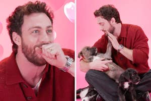 Aaron Taylor-Johnson in casual clothing smiles and plays with puppies, creating a joyful and heartwarming scene on a pink background