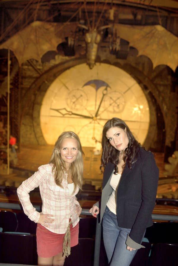 Kristin Chenoweth and Idina Menzel standing in front of the Wicked stage in San Francisco