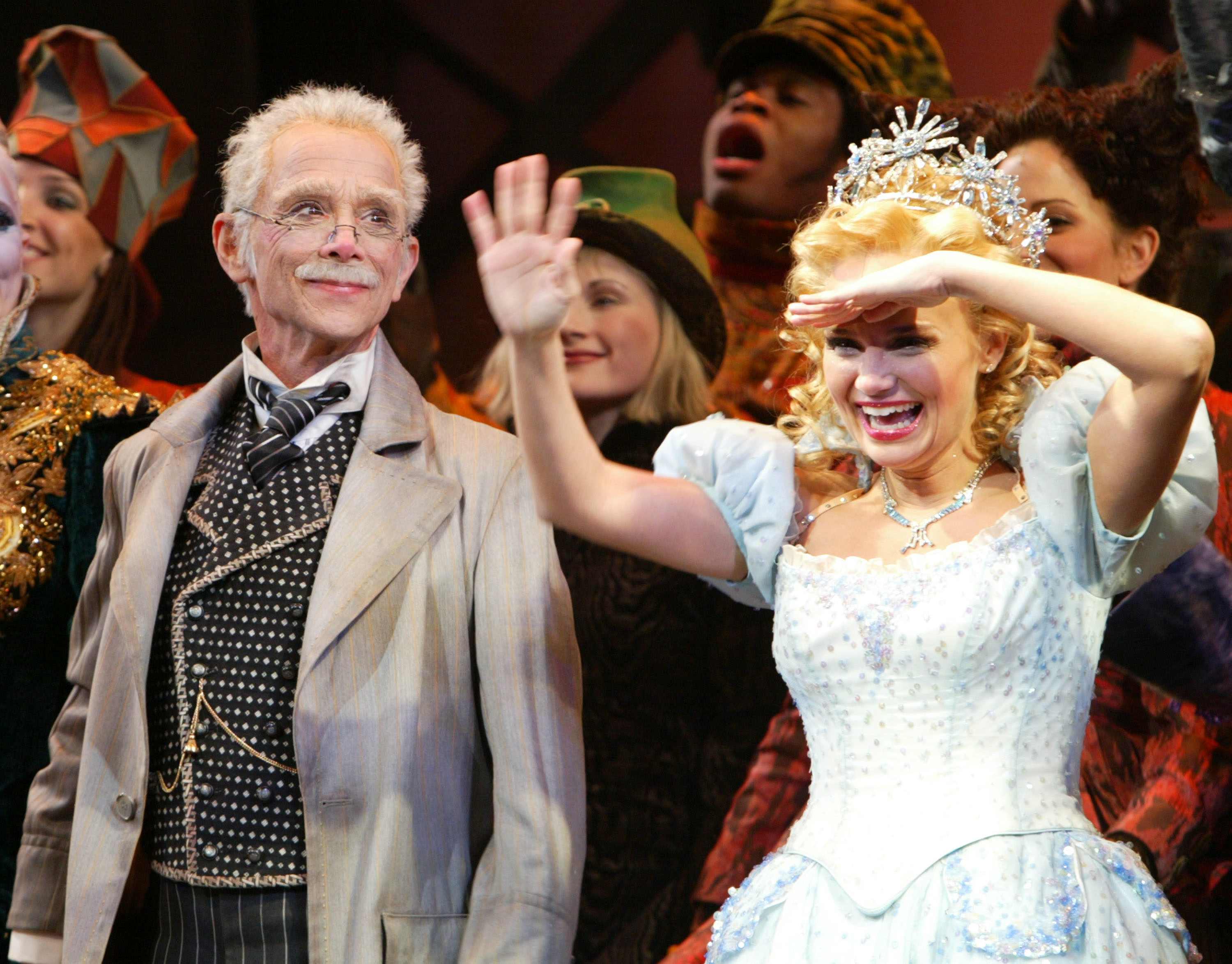 Kristin Chenoweth and Joel Grey celebrating on stage during a Wicked curtain call