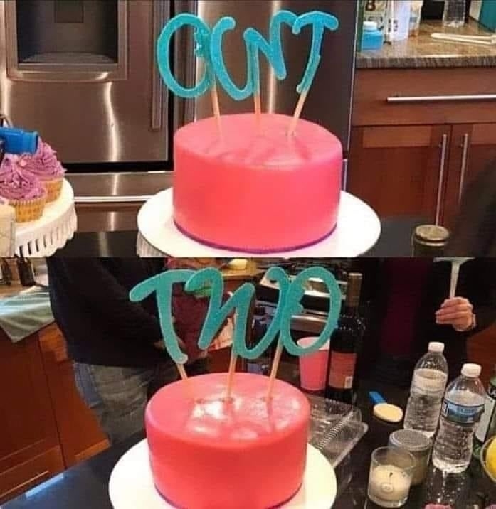 Cake with blue letters on top. At first, it reads "CUNT." Rearranged letters reveal "TWO." Nearby are cupcakes and drinks
