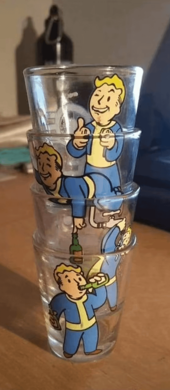 Stack of four shot glasses with "Fallout" game character in various poses