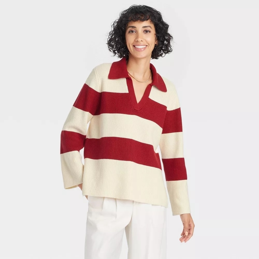 Model wearing red and white striped top with white pants