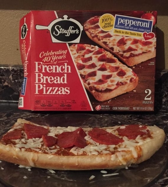 Stouffer's French Bread Pizza connected a plate, with the packaging successful the inheritance celebrating 40 years of the product