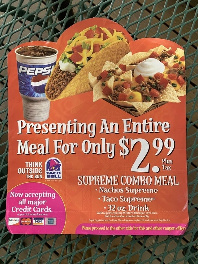 Taco Bell promotion for a $2.99 repast woody with tacos, nachos, and a drink. Includes logos for Taco Bell, Pepsi, large recognition cards accepted