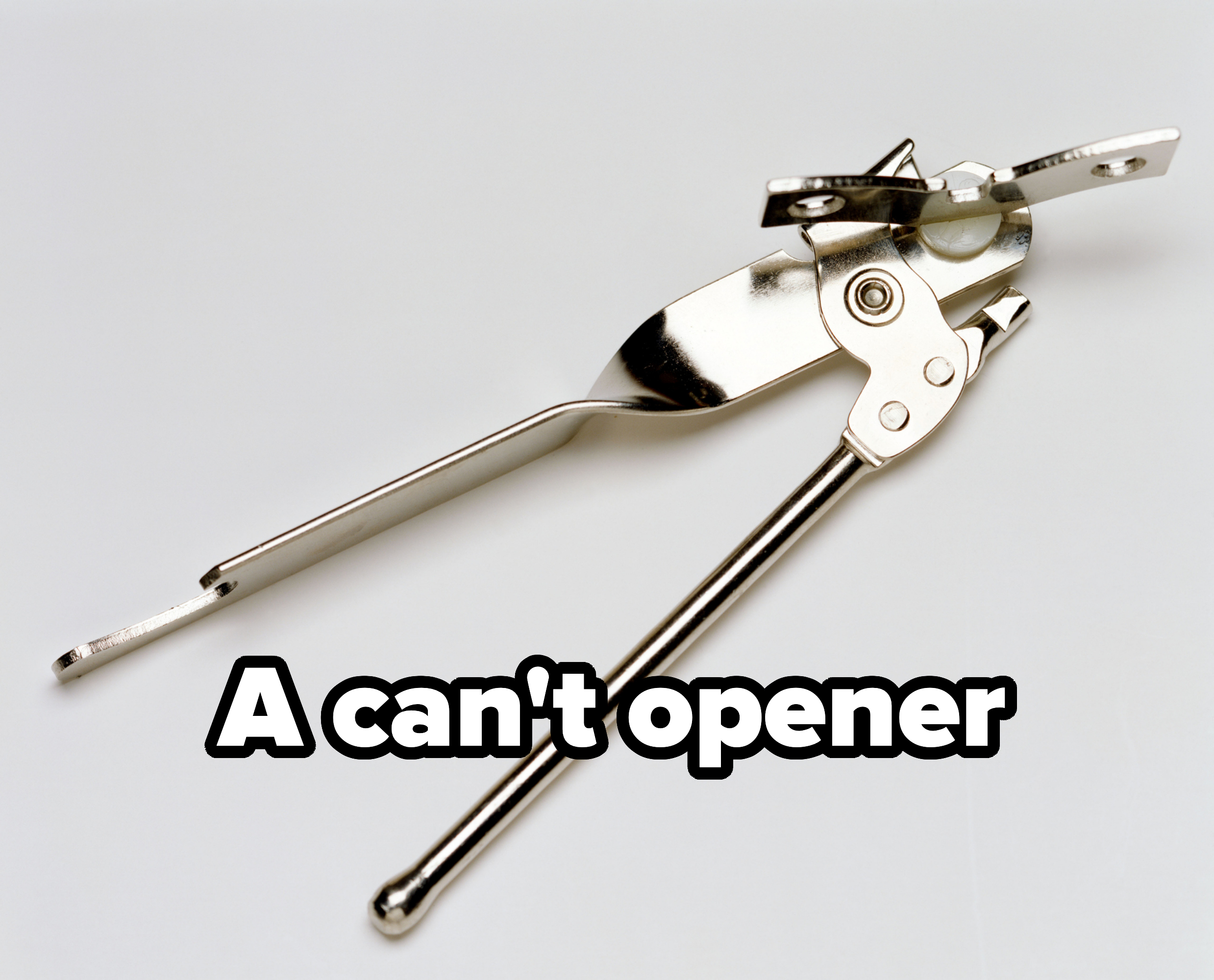 Metal can opener with rotating gear and handle