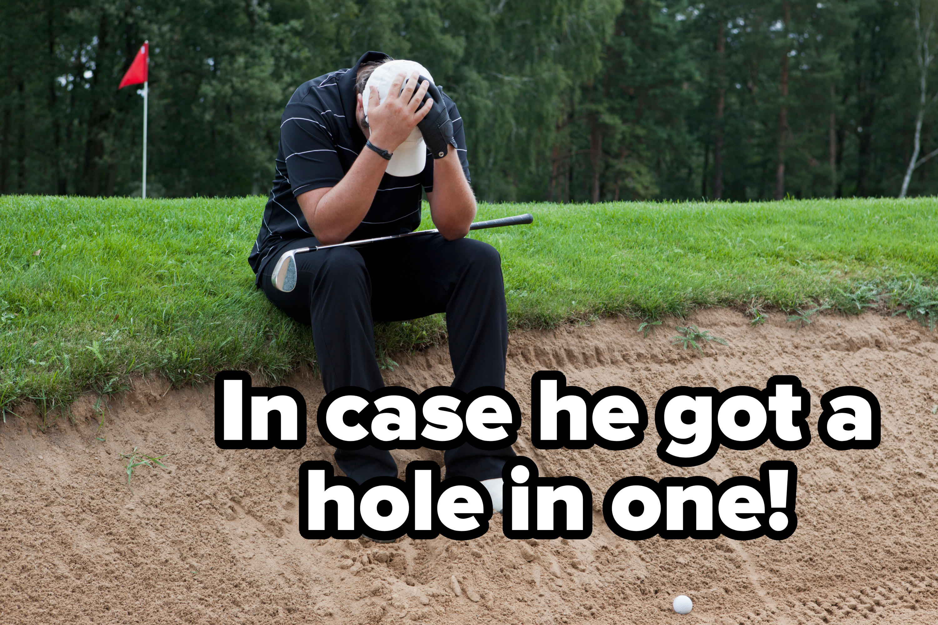 Golfer sitting in a sand trap, head in hands, with a club across lap and a golf ball nearby