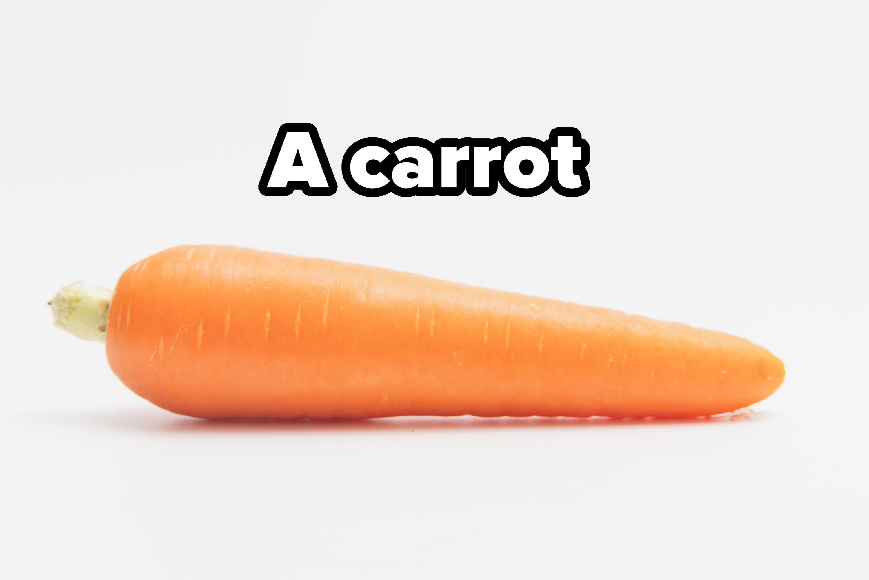 Carrot on a plain background, showing its tapered shape and smooth surface