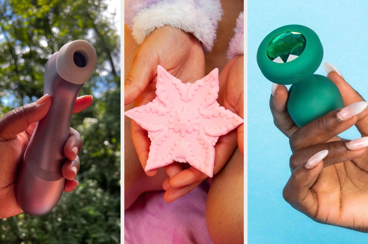 Three hands each holding a different sex toy: a purple satisfyer suction vibrator, a pink star-shaped vibrator, and a green anal plug with a bejeweled base