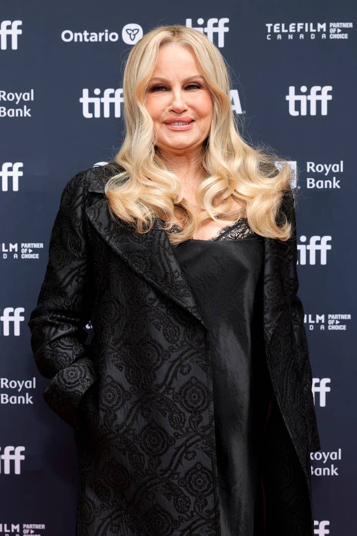 Person in black patterned coat at film festival event