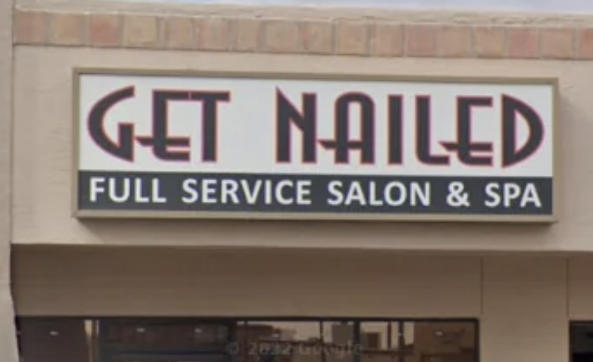 Sign for "Get Nailed," a full-service salon and spa