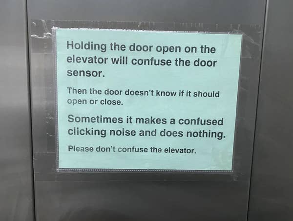 Sign on elevator explains that holding the door open confuses the sensor, causing clicking sounds. It advises not to confuse the elevator