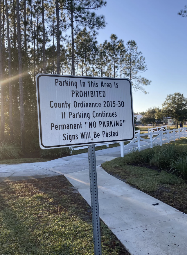 Sign details parking prohibition under County Ordinance 2015-30, warning of potential "No Parking" signs for continued violations