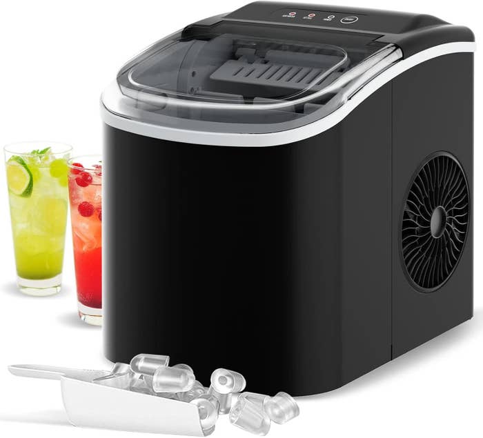 Countertop ice maker next to two beverages, with ice cubes and scoop in front. Featured in shopping article