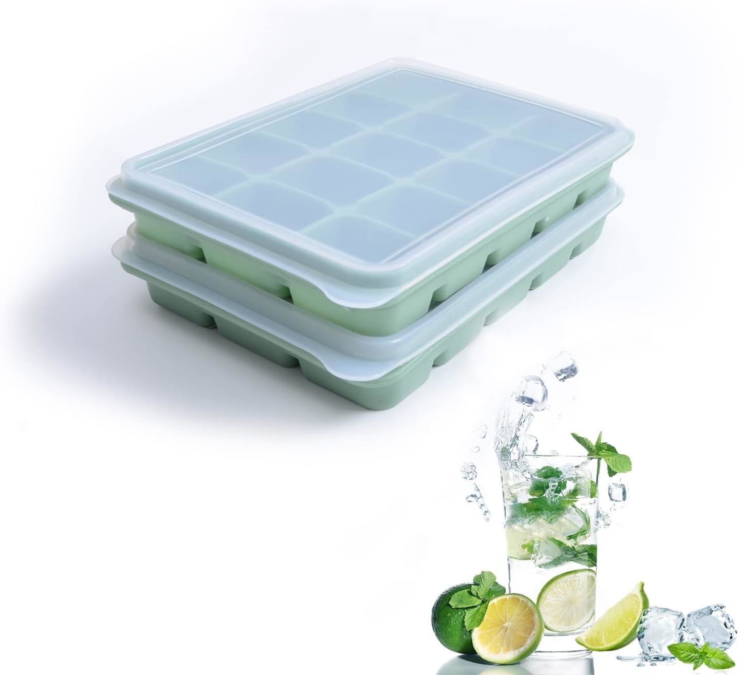 Two stackable ice cube trays next to a refreshing drink with mint and citrus slices