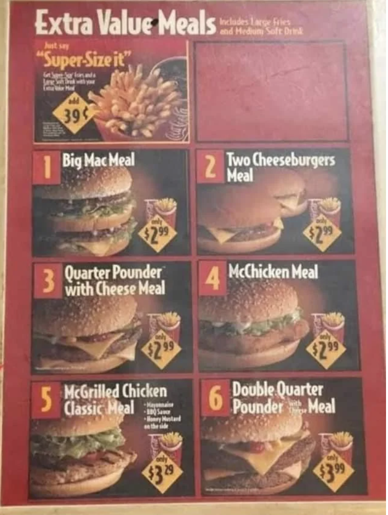 Fast food menu offering six value meals with prices: Big Mac, Two Cheeseburgers, Quarter Pounder with Cheese, McChicken, McGrilled Chicken, Double Quarter Pounder