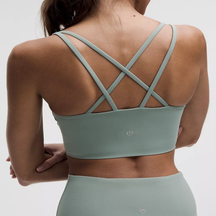 Person wearing a cross-back sports bra and matching leggings, viewed from behind