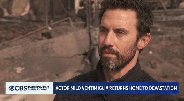 A man with a beard speaks outdoors with burnt debris in the background. The news caption reads: "Actor Milo Ventimiglia returns home to devastation."
