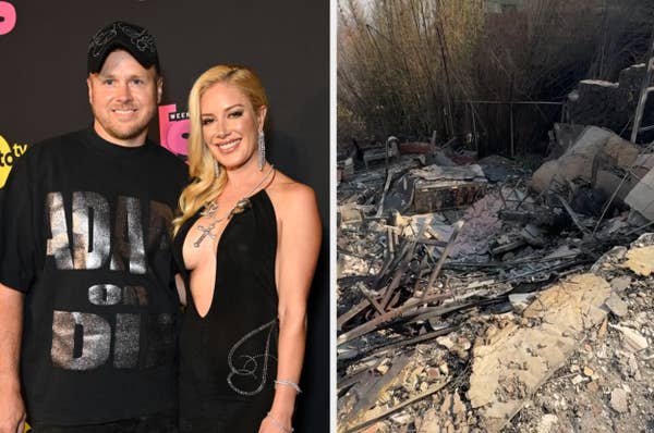 Two people on a red carpet; the woman wears a black dress with a necklace, and the man wears a graphic T-shirt and cap. Ruins of a burnt house