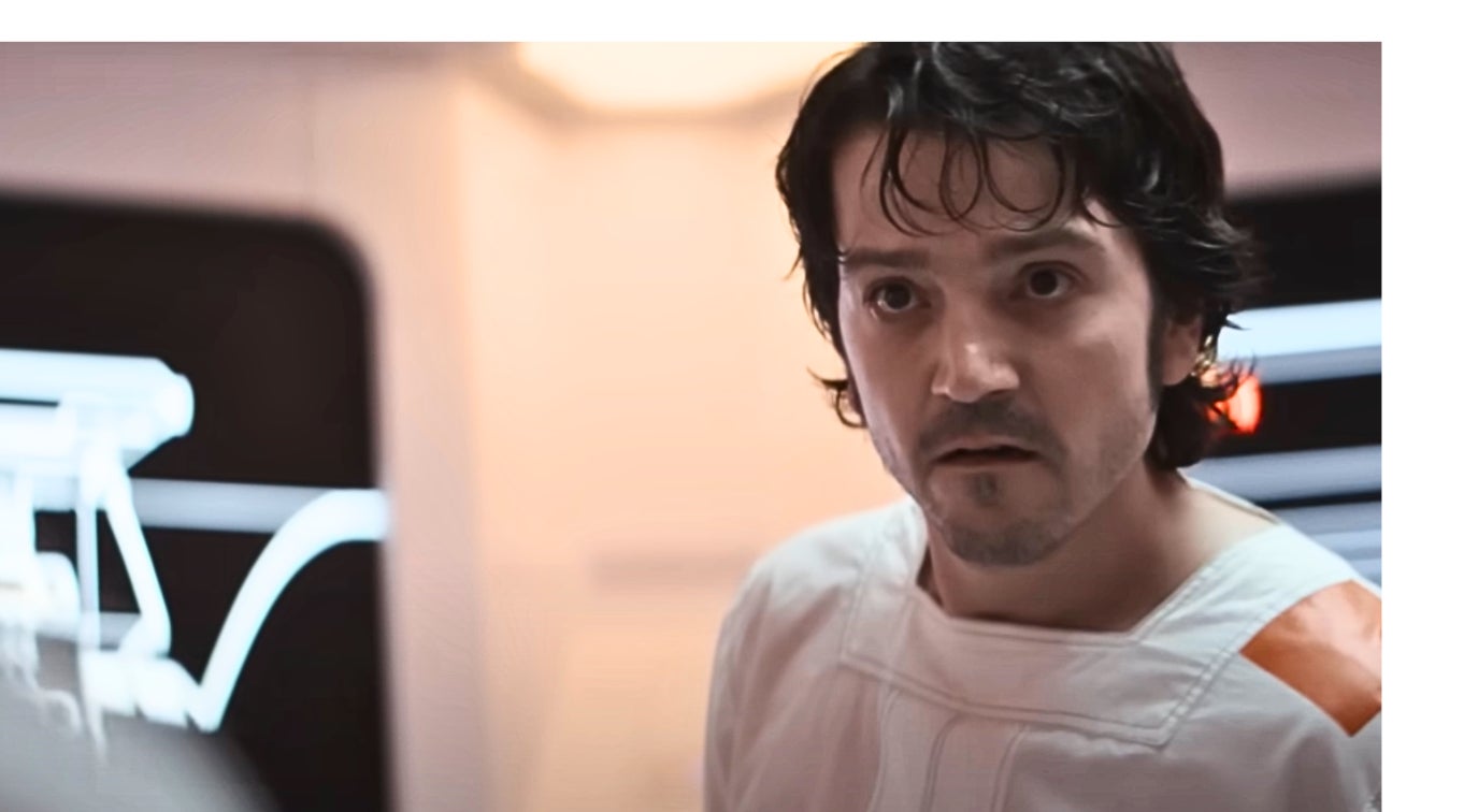 Person in a futuristic or sci-fi setting, wearing a white outfit