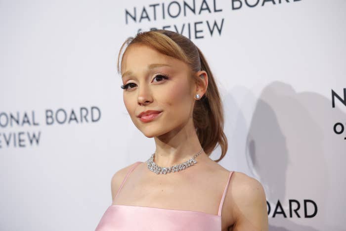 Ariana Grande in elegant dress poses at National Board of Review event, wearing a necklace
