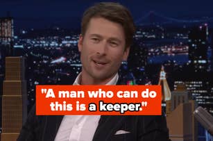 A man in a suit appears on a talk show set with a cityscape background. Text overlay: "A man who can do this is a keeper."