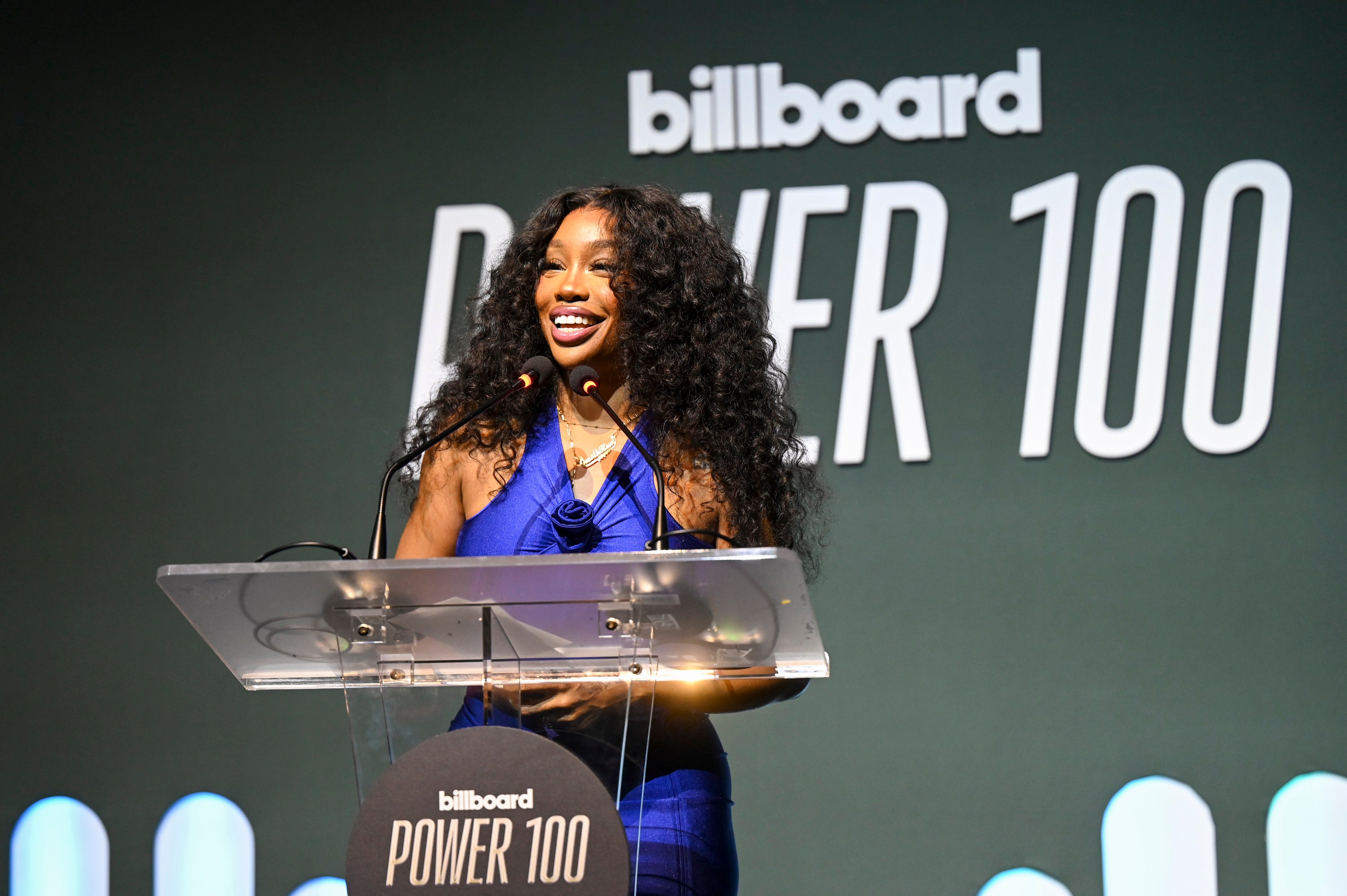 SZA in a stylish outfit speaks at the Billboard Power 100 event