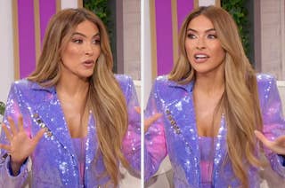 Person excitedly gesturing while speaking in a sparkling blazer during an interview setting